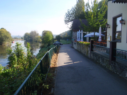 We are passing by a river side restaurant.